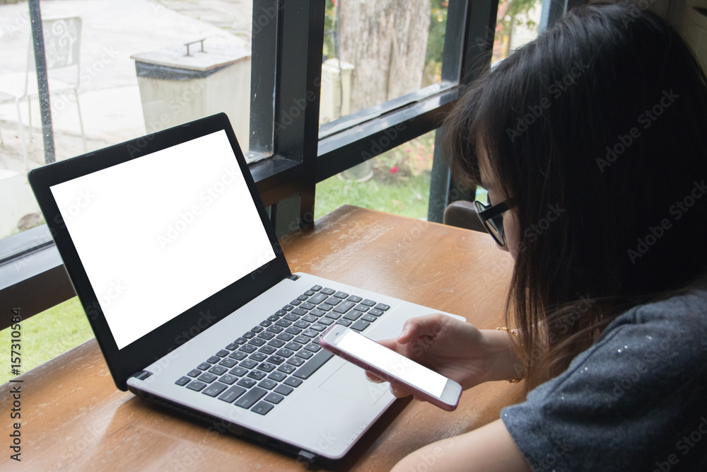 Girl used smart phone on wooden table. copy space Girl used smart phone on wooden table. copy space