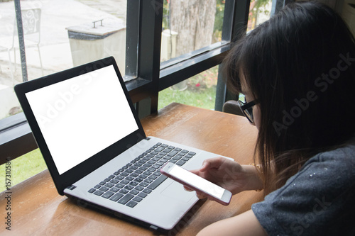 Girl used smart phone on wooden table. copy space © mutarider15