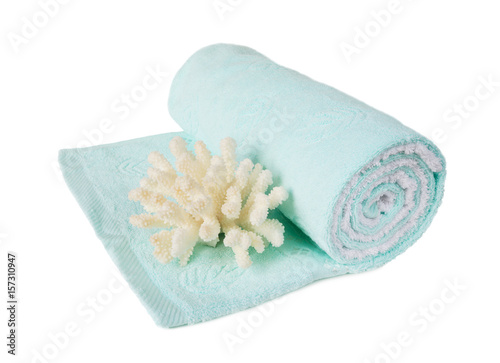Towel and coral on white background