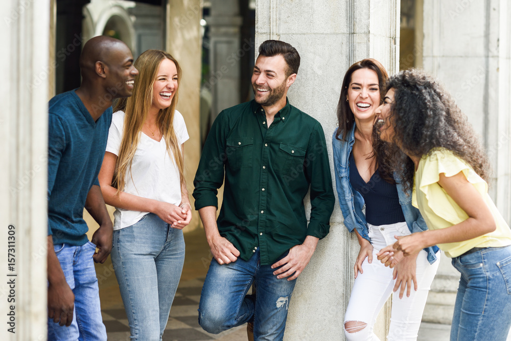 Fototapeta premium Multi-ethnic group of friends having fun together in urban background
