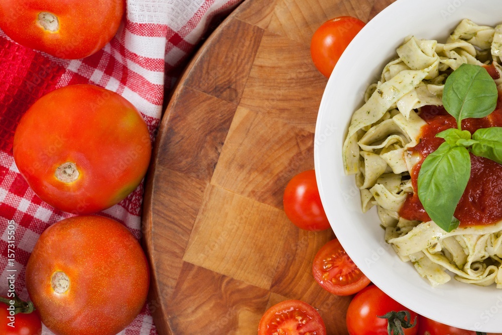 Fettuccine pasta with tomatoes, garlic and napkin cloth Fettuccine pasta with tomatoes, garlic and napkin cloth