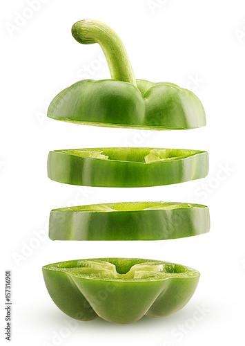 Slices green bell pepper flying in the air photo