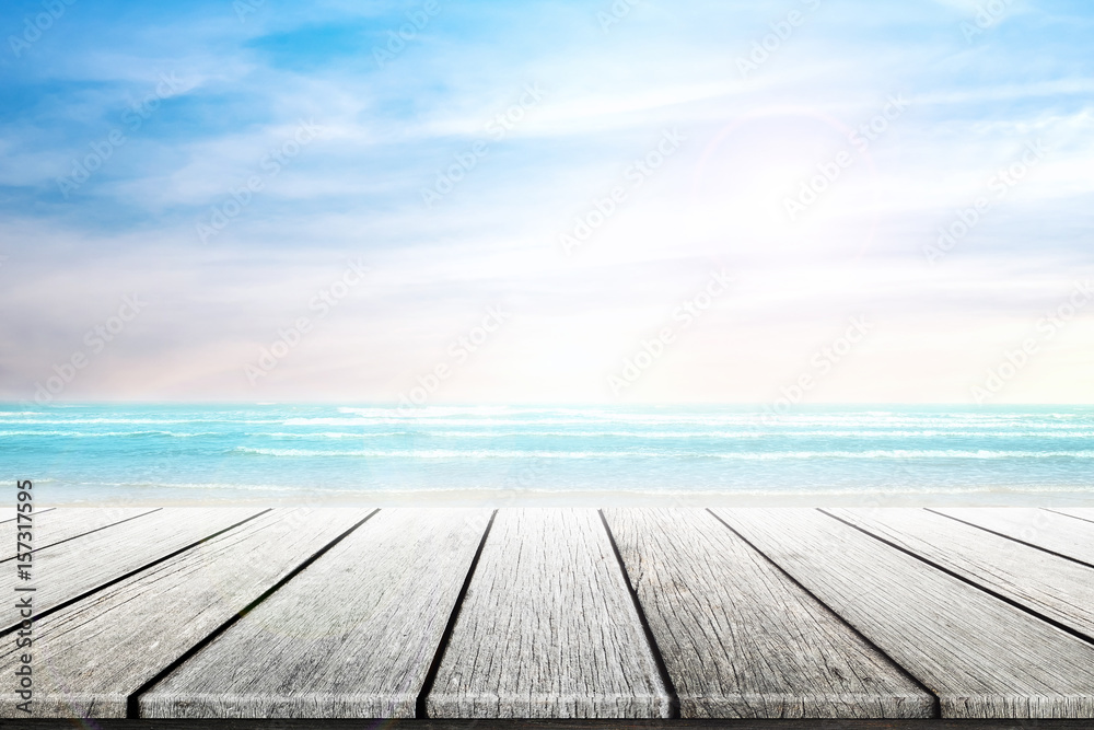Empty wooden table with party on beach blurred background in summer time. Empty wooden table with party on beach blurred background in summer time.