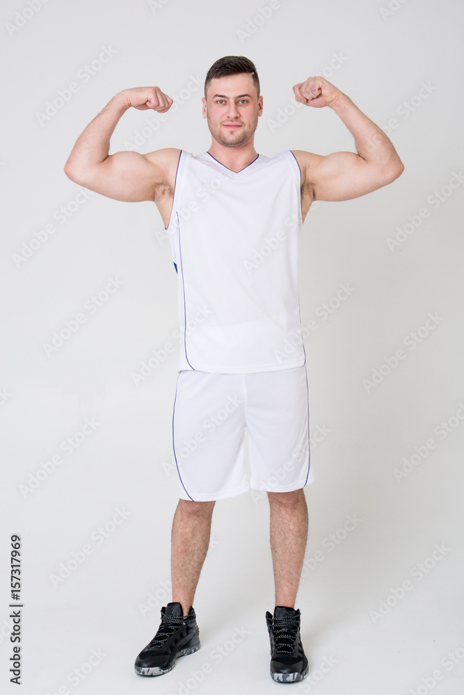 Man in sports uniform shows biceps Man in sports uniform shows biceps
