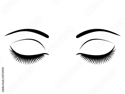 Fototapeta Closed eyes with black eyelashes on a white background.