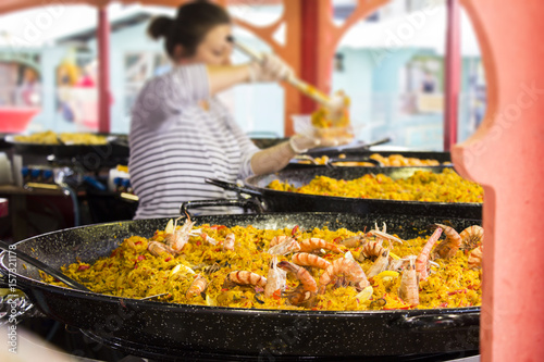 Canvas Print Seafood paella sold at street market stand