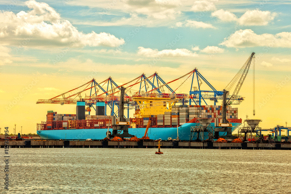 Container ship at sunset in Port of Gdansk, Poland. Container ship at sunset in Port of Gdansk, Poland.