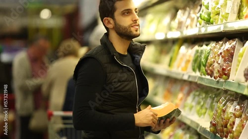 Young Man Shopping at Supermarket