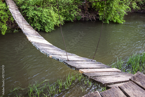 Valokuvatapetti wooden suspension footbridge