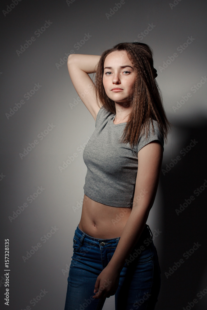 Portrait of young beautiful girl brunette in the Studio Portrait of young beautiful girl brunette in the Studio