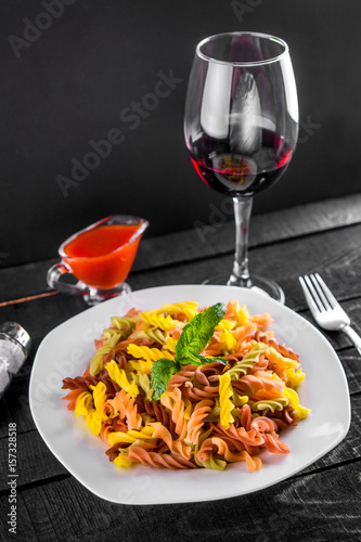 Colourful pasta with wine