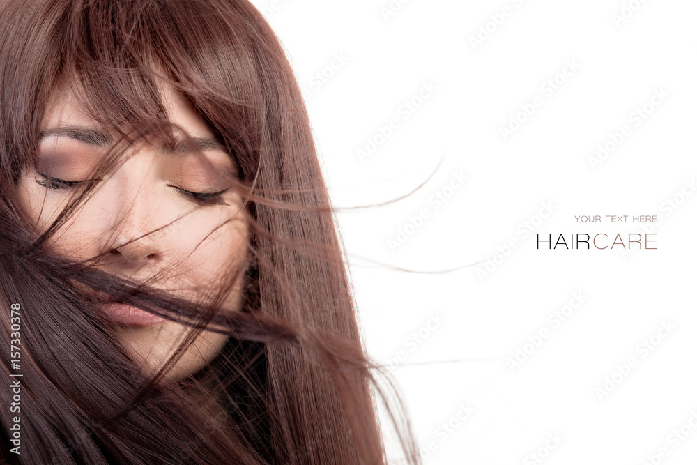 Beauty model with healthy long hair blowing over face Beauty model with healthy long hair blowing over face