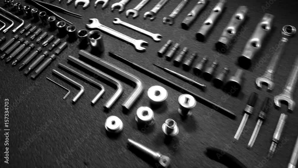 Camera flying over set of steel tools macro shot video 
