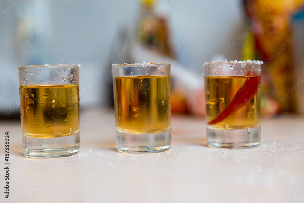 glasses with vodka and pepper glasses with vodka and pepper