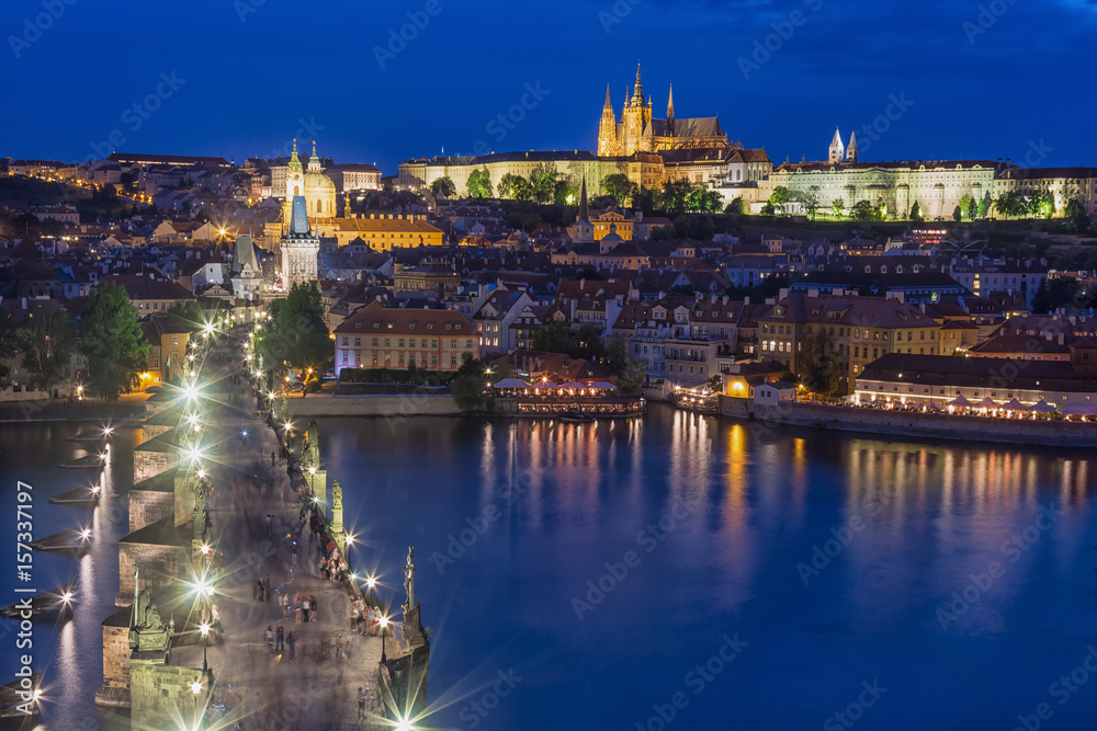 View of Charles Bridge, Prague Castle and Vltava river in Prague, Czech Republic during blue hour