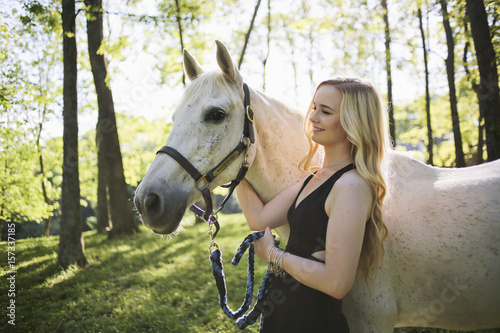 Female with Blond Hair and a White Horse in Rural Virginia