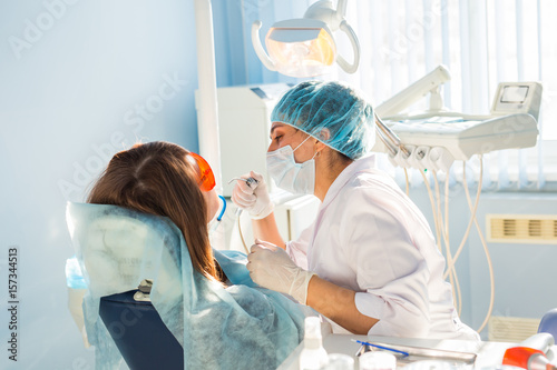 Young woman getting dental treatment.