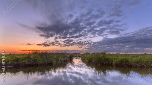 Sunset over waterway split