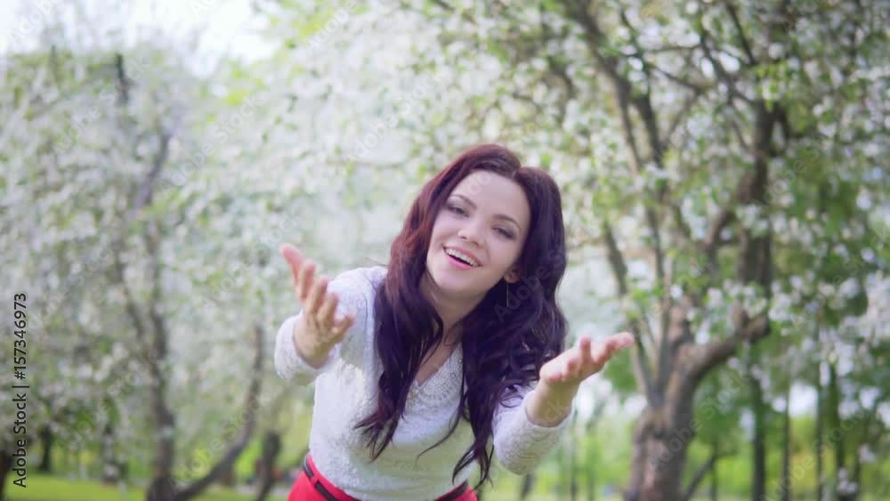 Young attractive woman with open arms in the park smiling Young attractive woman with open arms in the park smiling