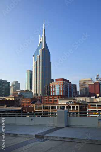 beautiful towering new office building surrounded by older brick buildings in Nashville, Tennessee