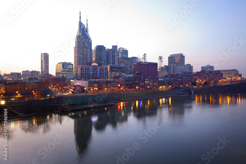 Skyline of Nashville  Tennessee at sunset showing reflections in the Cumberland River