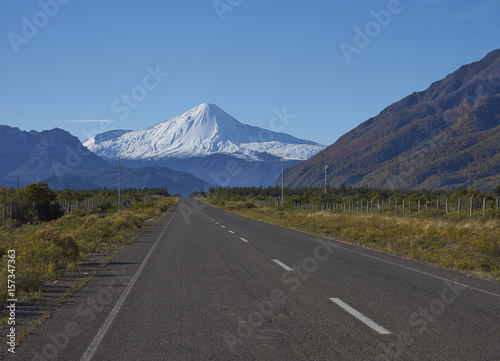Snow capped peak of Antuco Volcano (2,979 metres) rising above the road to Laguna de Laja National Park in the Bio Bio region of Chile.