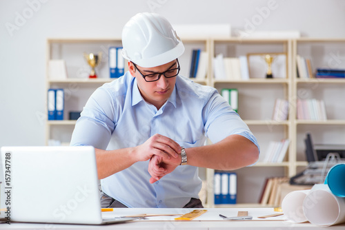 Male engineer working on drawings and blueprints