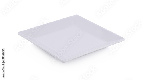 Empty white plate isolated on a white background © tapaton