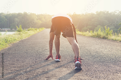 man running and jogging on road ; Healthy lifestyle with outdoors summer 