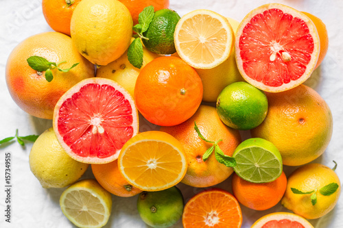 A large assortment of colorful citrus fruit  lemon  lime  orange  grapefruit  mandarin  tangerine  pomelo 