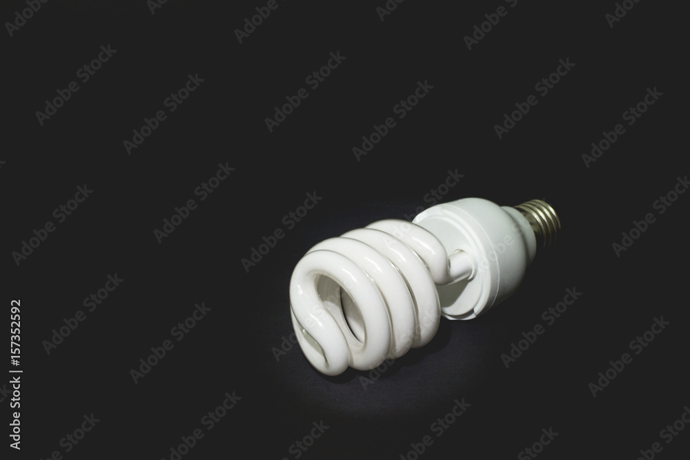 Light bulbs on wooden table., dark background. Light bulbs on wooden table., dark background.