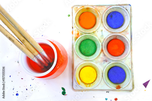 Wallpaper Mural Flat lay view of water colours and paint brush on a white background Torontodigital.ca