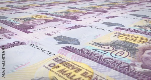 Banknotes of twenty malawian kwacha of Malawi rolling, cash money, loop photo