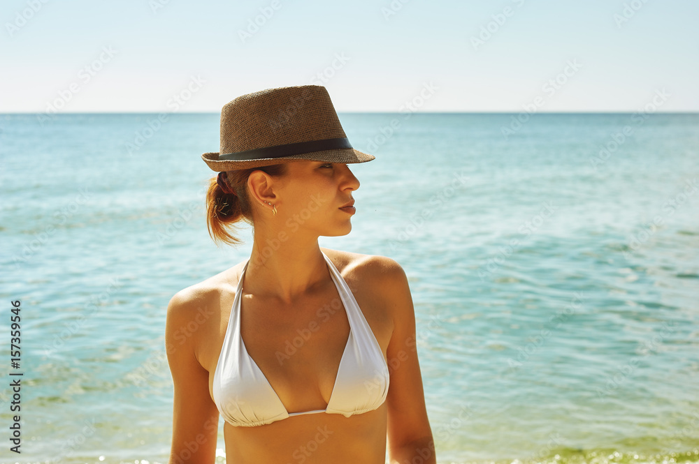 Young woman on the beach .The concept of summer vacation
