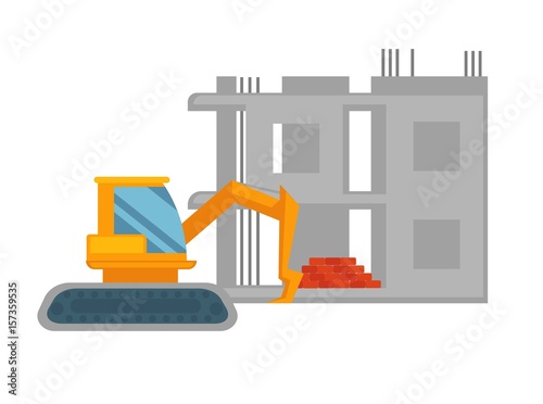Orange excavator and unfinished building with pile of red bricks