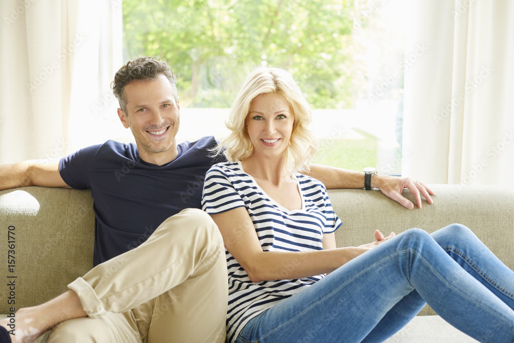 Shot of a cheerful couple relaxing at home.