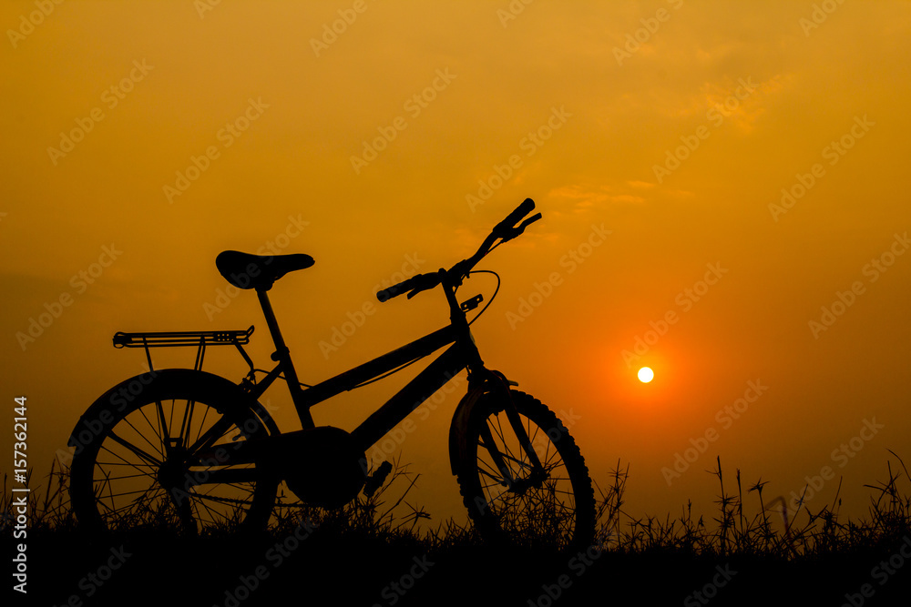 Fototapeta premium Bike silhouette and sunset light.