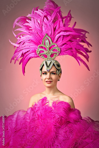 Fotografija Beautiful Girl in carnival costume with pink feathers.
