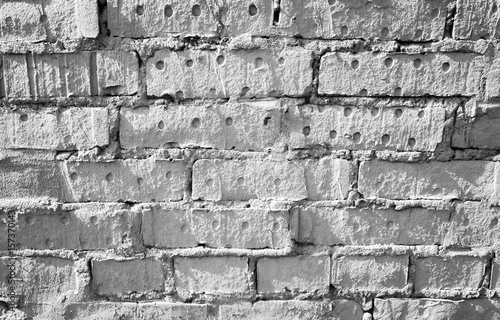 Old grungy white brick wall, close-up background