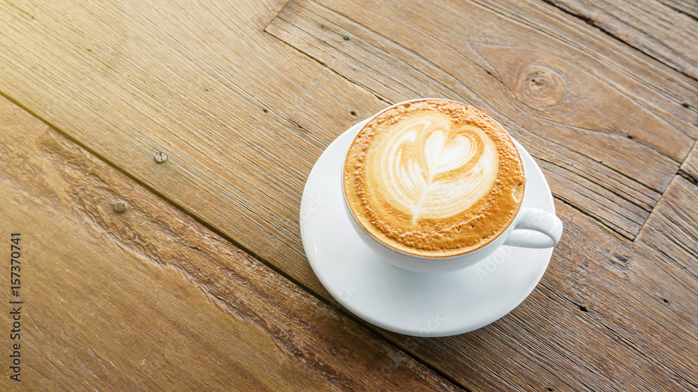 Hot coffee on a wooden table. Hot coffee on a wooden table.