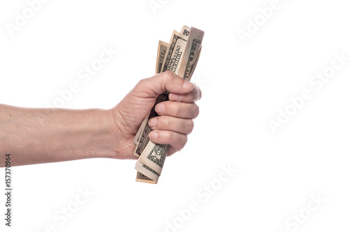 Male hand squeezing tightly some banknotes