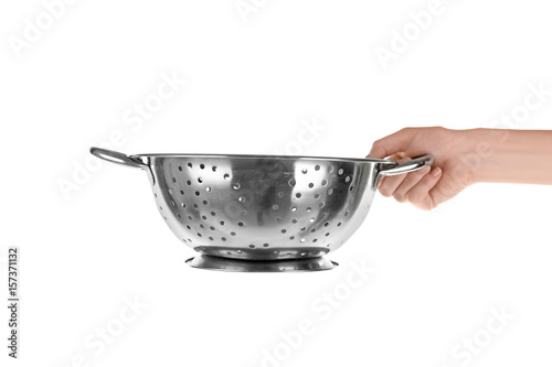 Woman holding colander for cooking classes on white background photo