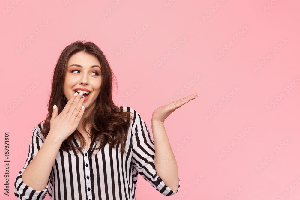 Fototapeta premium Girl gesturing in amazement on pink