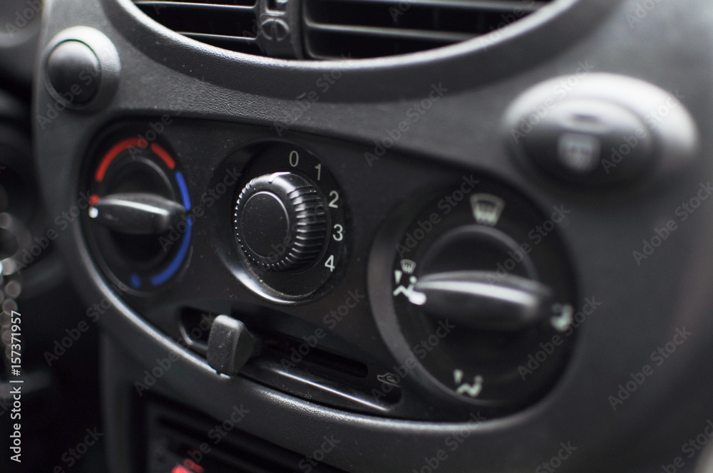 The air conditioning control dials in a car's control panel.