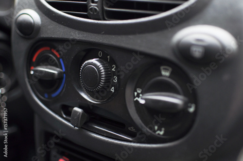 The air conditioning control dials in a car's control panel. © malykalexa777