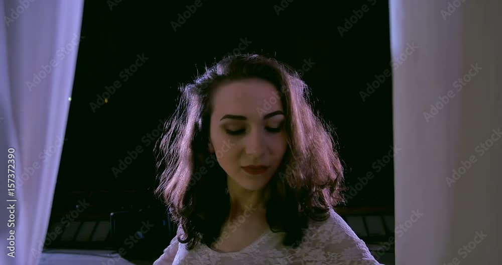 Woman dancer on white aerial silk, aerial contortion. Disappears