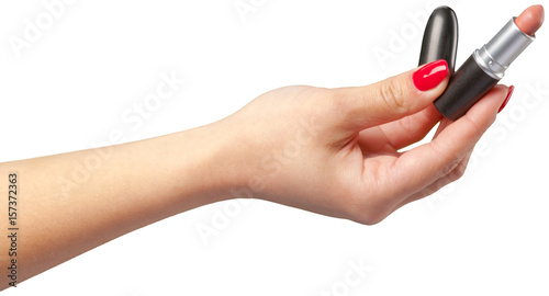 lipstick in hand isolated on white .