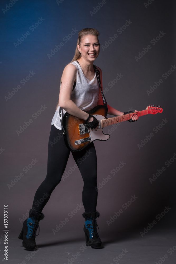 Girl with guitar at the rehearsal before the performance Girl with guitar at the rehearsal before the performance