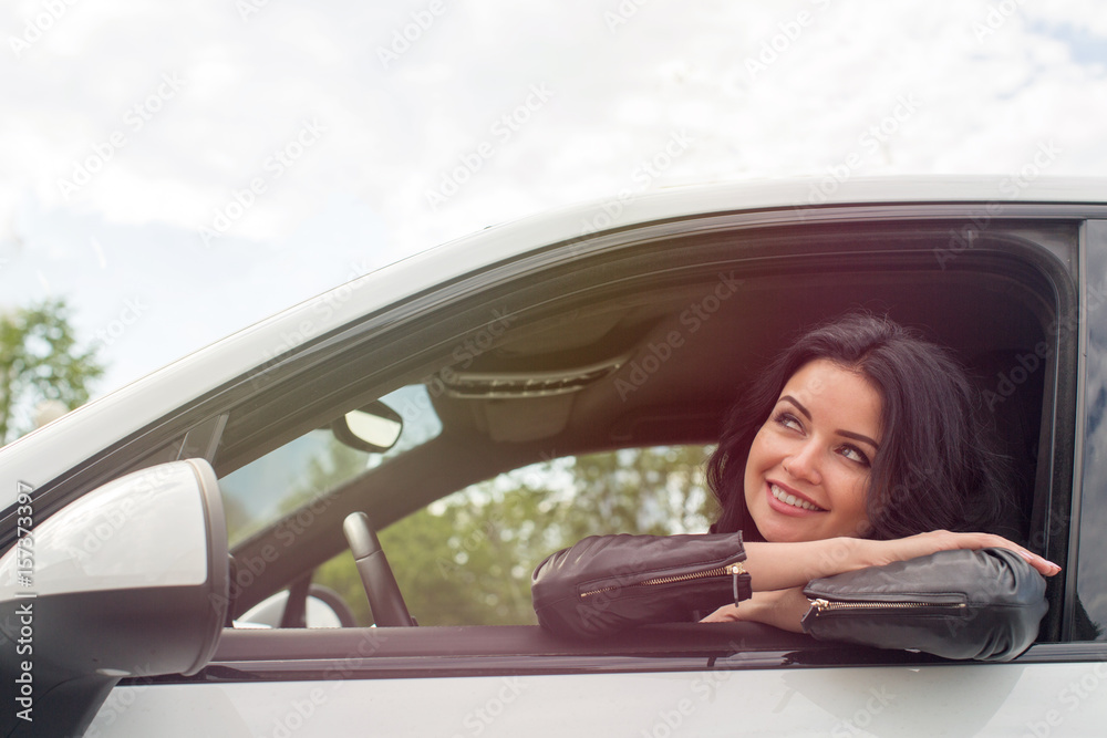 Young Woman Sitting Inside Car Smiling