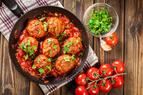 Pork meatballs with spicy tomato sauce photo